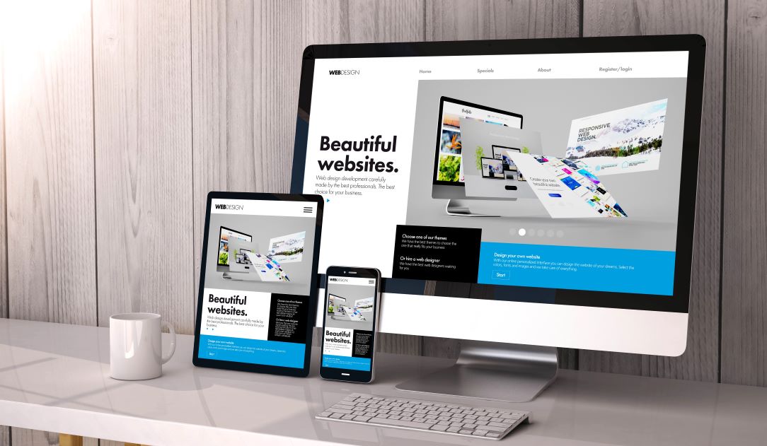 Website Design & Development Expertise Image of a desktop and laptop displaying websites, featuring SEO & Reputation Management and highlighting expertise in website design and development.